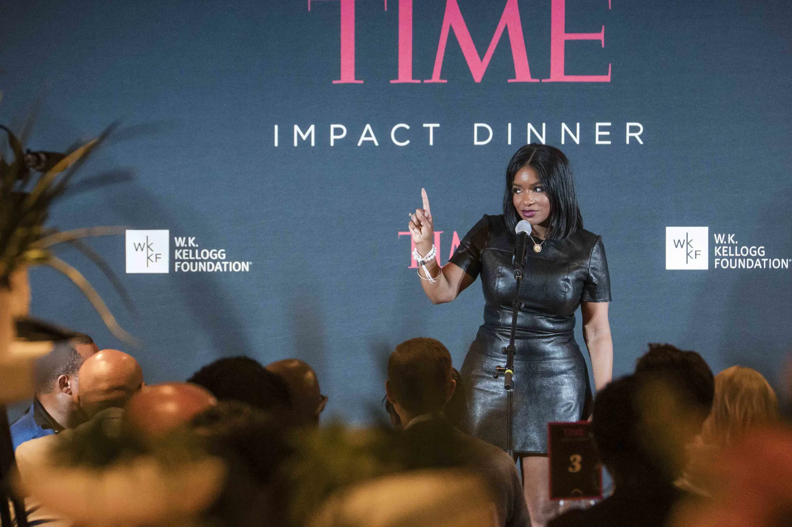 At the podium, TIME Impact Dinner